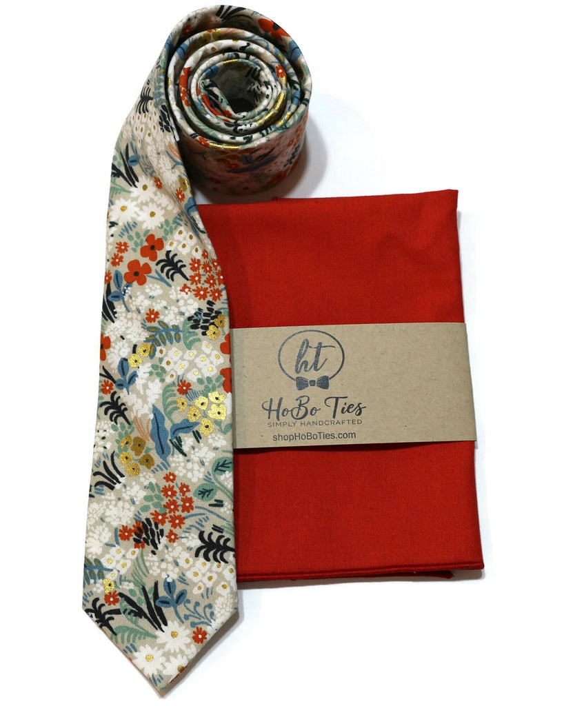 Flax Metallic Meadow Floral Necktie alongside a red pocket square, showcasing handcrafted neckties and wedding accessories for men.