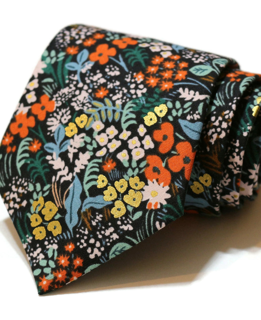 Black Metallic Meadow Floral Necktie displayed with vibrant floral patterns for men's formal wear accessories.