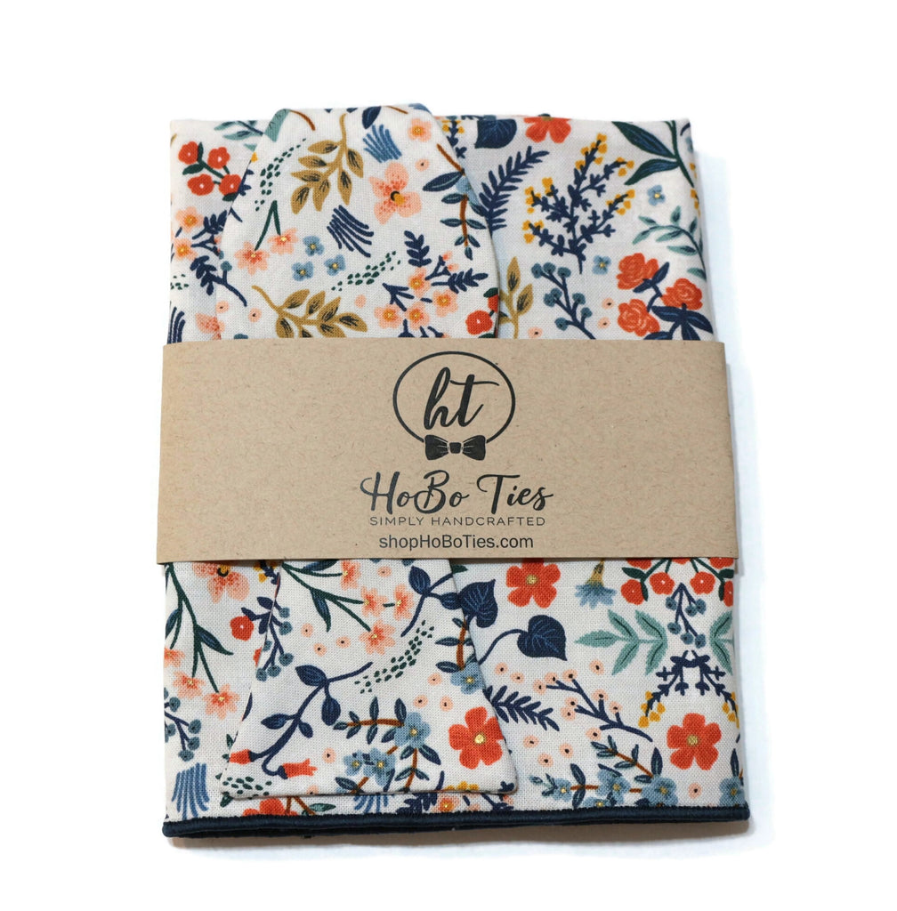 White Metallic Wildwood Floral Bow Tie, a handcrafted bow tie for men featuring vibrant floral patterns and quality craftsmanship.