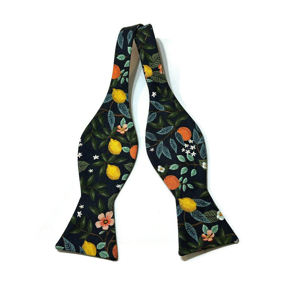 Navy Citrus Grove Floral Bow Tie showcasing unique floral patterns, perfect for men's wedding accessories and handcrafted neckties.