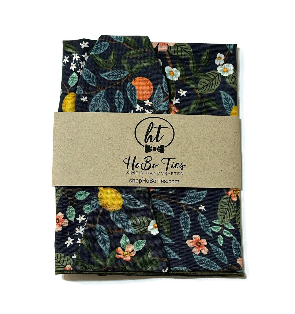 Navy Citrus Grove Floral Bow Tie handcrafted neckties for men with unique floral pattern and vibrant colors.