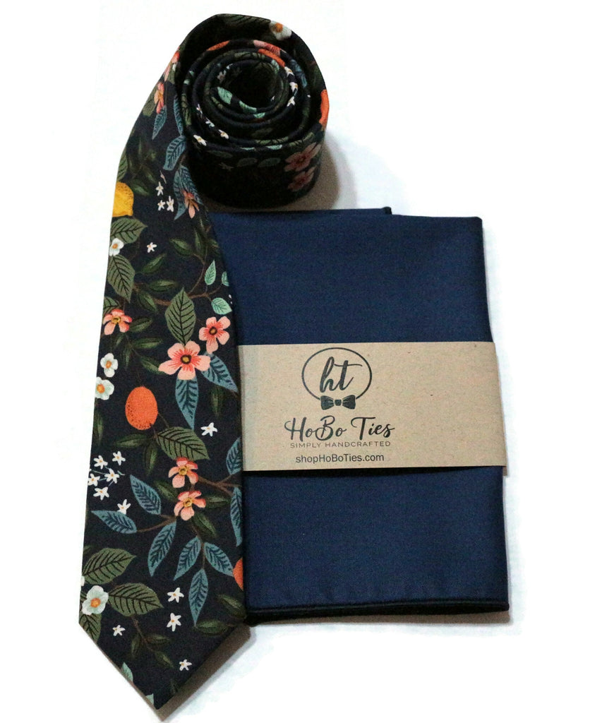 Navy Citrus Grove Floral Necktie with matching pocket square and rolled tie, perfect for men's wedding accessories.