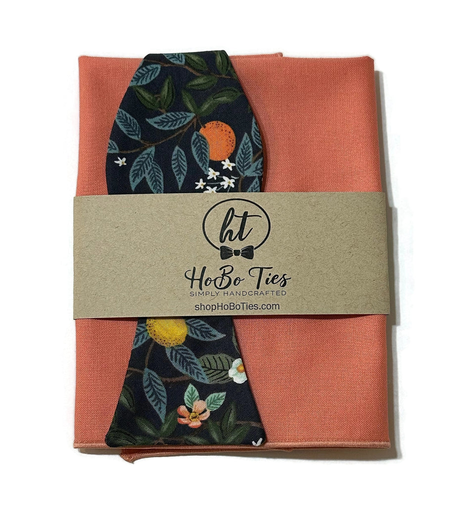Navy Citrus Grove Floral Bow Tie with orange and floral design, handcrafted neckties for men and boys, unique bow tie patterns.
