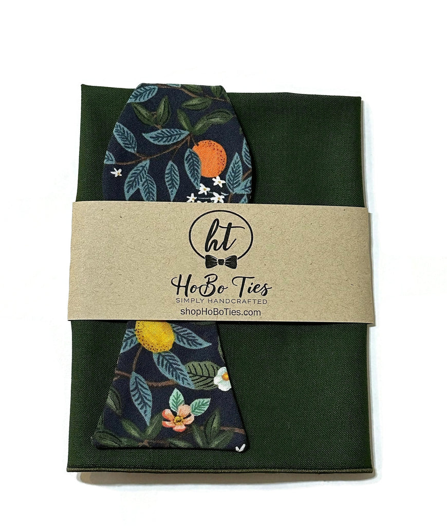 Navy Citrus Grove Floral Bow Tie with green pocket square, handmade bow ties for men, handcrafted neckties by HoBo Ties.