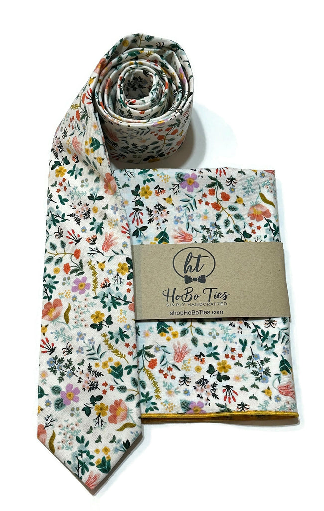White Bramble Fields Floral Necktie alongside a matching pocket square, perfect for weddings and formal wear accessories.