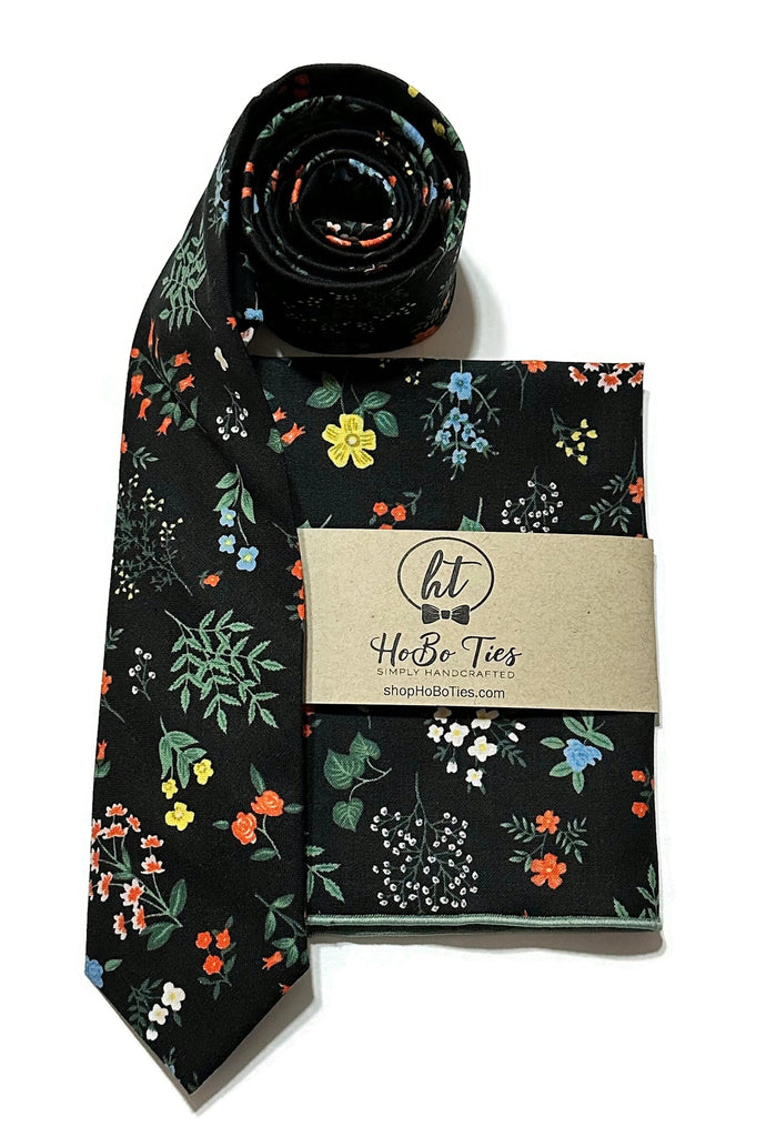 Black Hawthorne Floral Necktie featuring colorful floral patterns, handcrafted for men and boys wedding accessories.