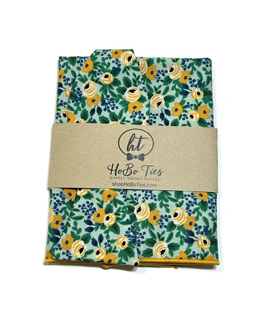 Mint Rosa Floral Bow Tie packaging showing vibrant floral design, showcasing handcrafted neckties and handmade bow ties.