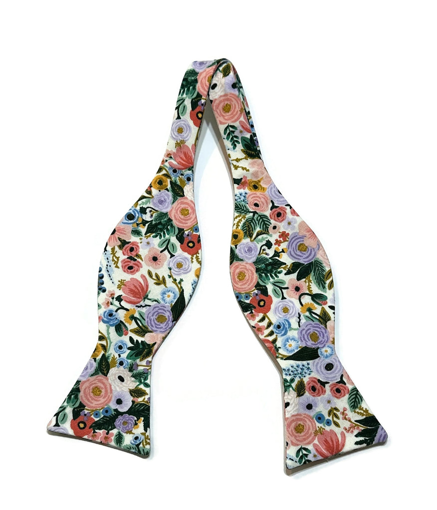 Ivory Garden Party Petite Floral Bow Tie, a handcrafted necktie featuring vibrant floral patterns perfect for weddings and special occasions.