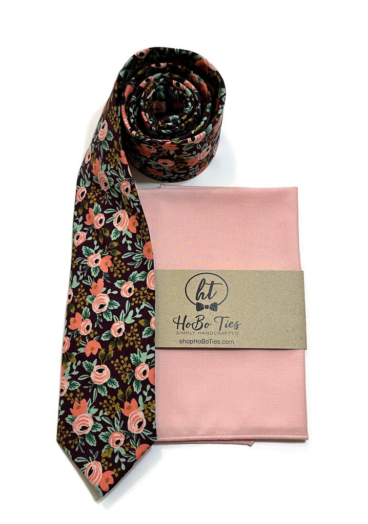 Currant Rosa Floral Necktie displayed with matching pocket square, showcasing handcrafted neckties and unique floral patterns.