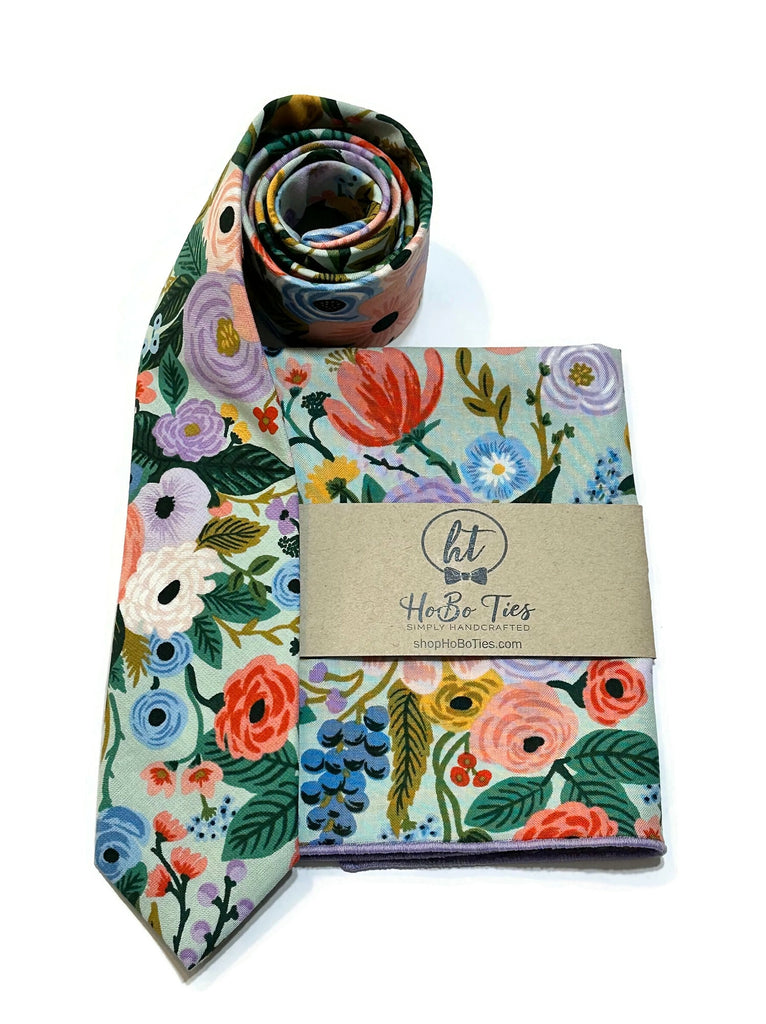 Mint Garden Party Floral Necktie with floral pattern, handcrafted neckties and matching pocket square on display.