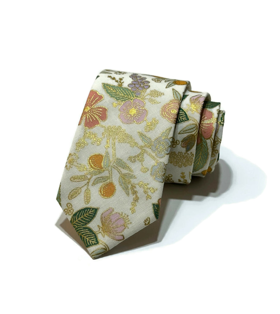 Cream Metallic Colette Floral Necktie showcasing vibrant floral patterns, handcrafted neckties for men and boys, unique wedding accessories.