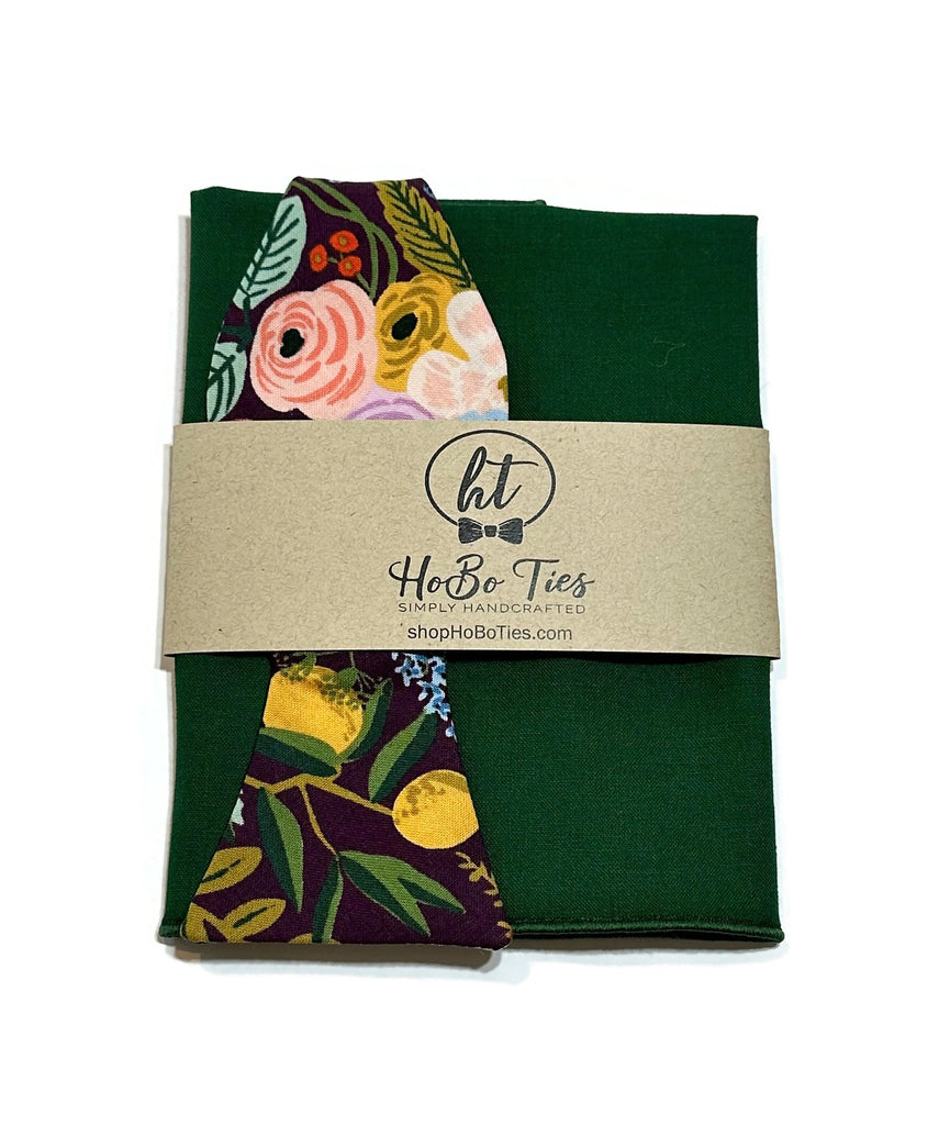 Eggplant Garden Party Floral Bow Tie paired with a solid green pocket square, handcrafted and unique design by HoBo Ties.