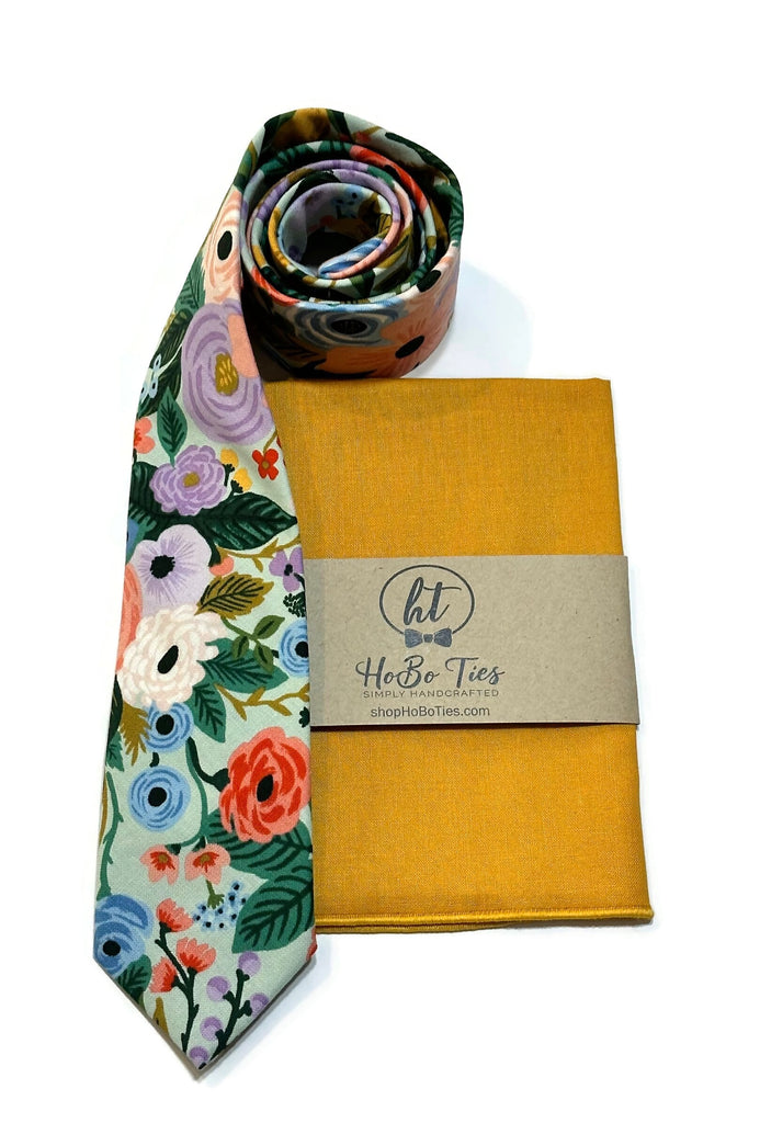 Mint Garden Party Floral Necktie alongside a matching pocket square, showcasing handcrafted neckties for men and boys.