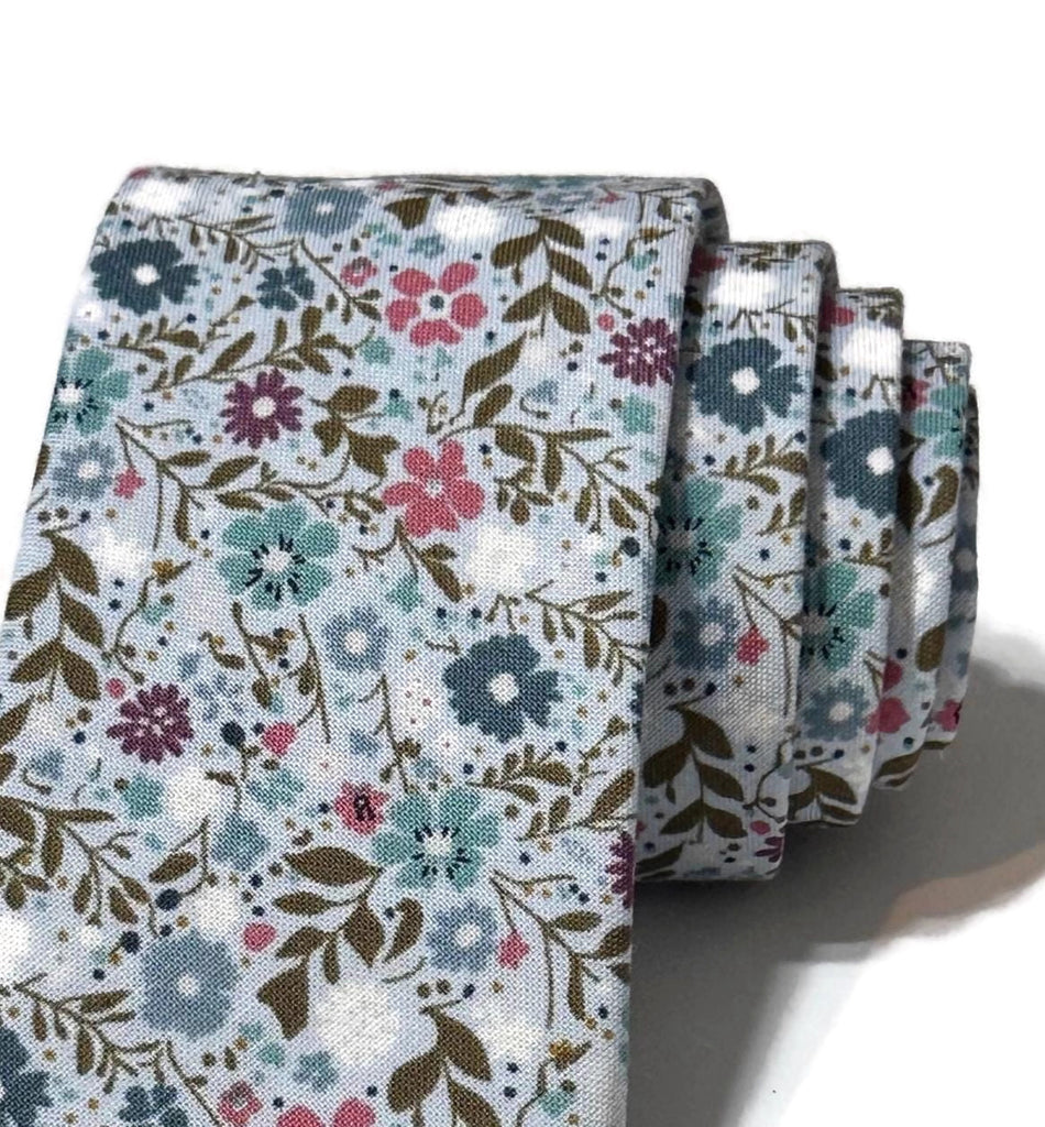 Sky Blue Happy Petals Floral Necktie showcasing a floral pattern, handcrafted neckties for men, perfect wedding accessories.