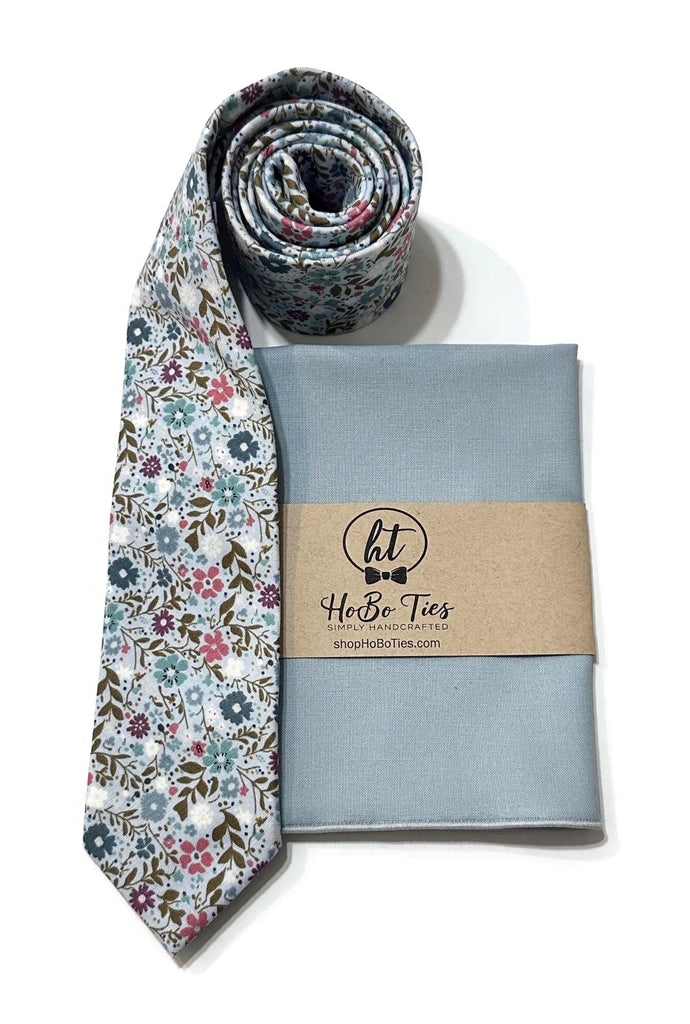 Sky Blue Happy Petals Floral Necktie paired with a matching pocket square, handcrafted neckties for men.