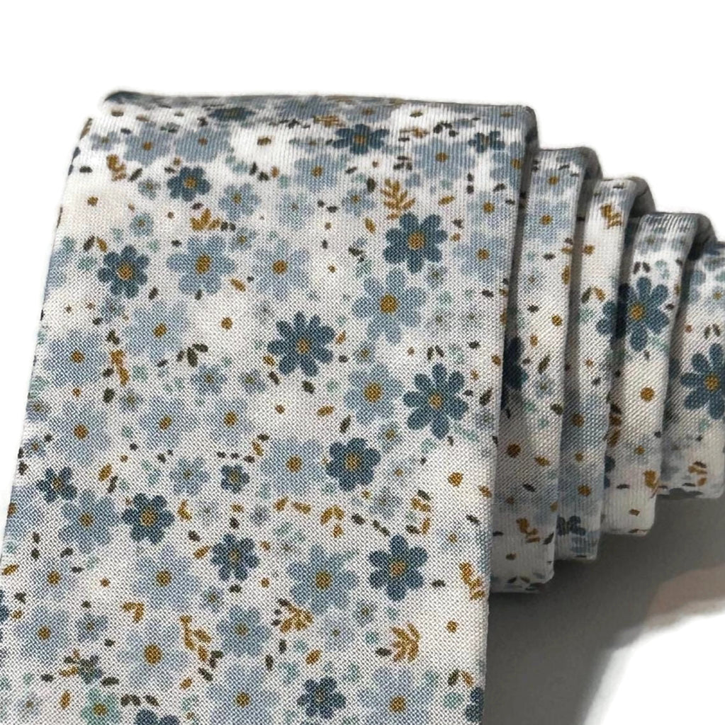 Powder Blue Field of Blooms Floral Necktie featuring delicate floral patterns, handcrafted neckties for men, perfect for weddings.