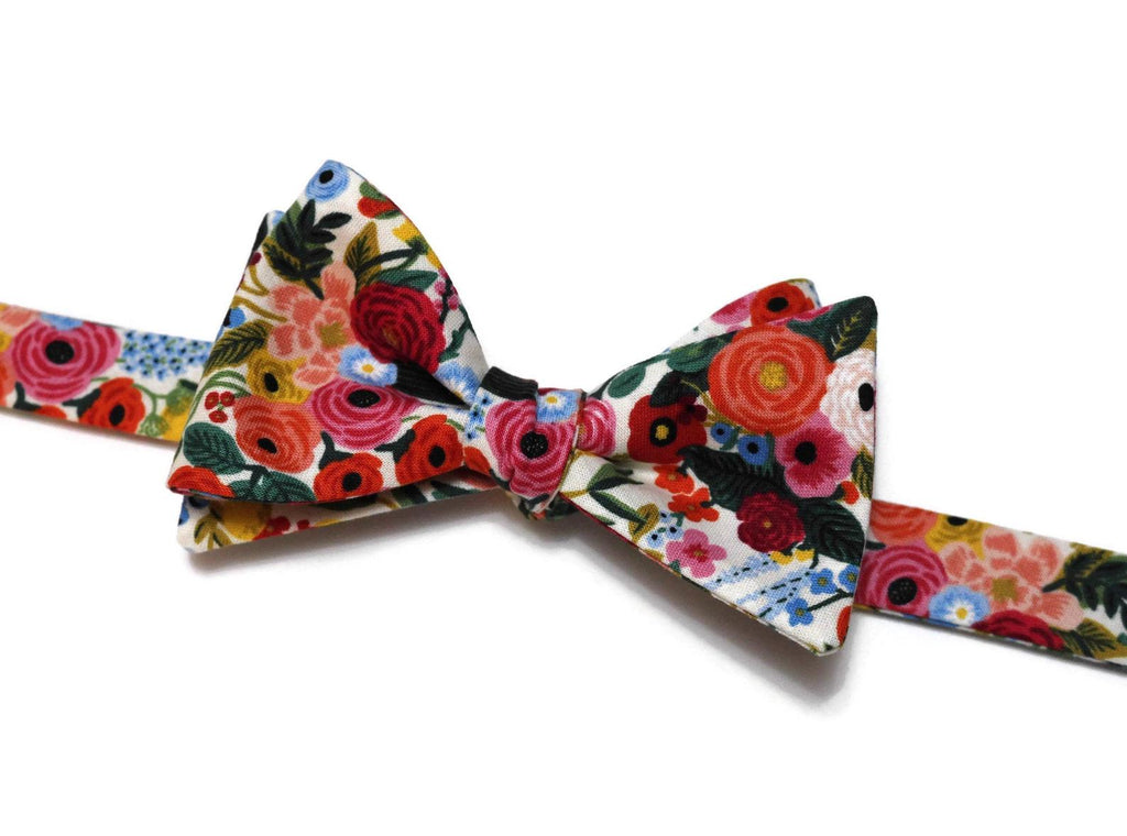 Cream Garden Party Petite Floral Bow Tie, a handcrafted necktie featuring vibrant floral patterns, perfect for weddings and formal events.