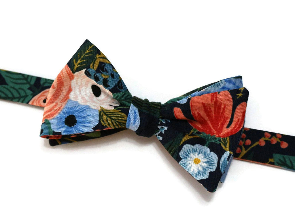 Navy Garden Party Floral Bow Tie featuring vibrant floral patterns, handcrafted neckties for men and boys wedding accessories.