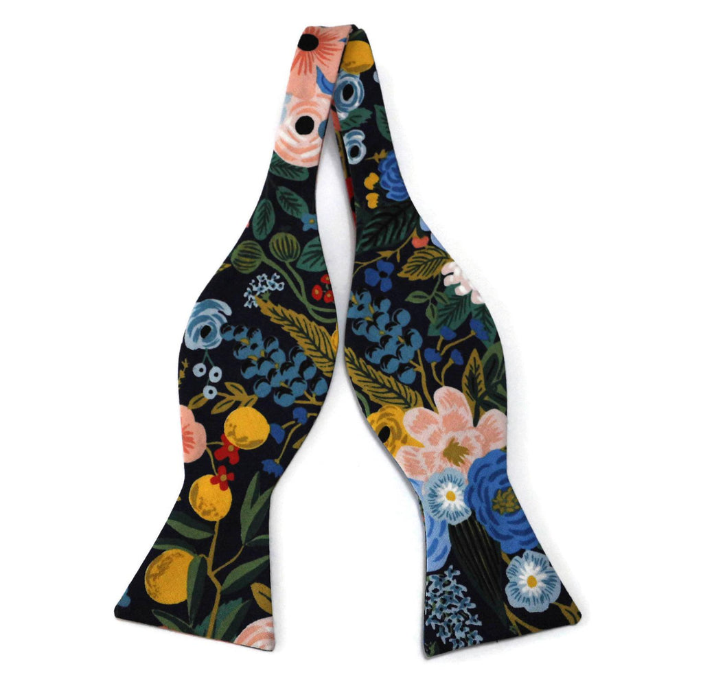 Navy Garden Party Floral Bow Tie featuring vibrant floral patterns and handcrafted design for men’s formal wear.