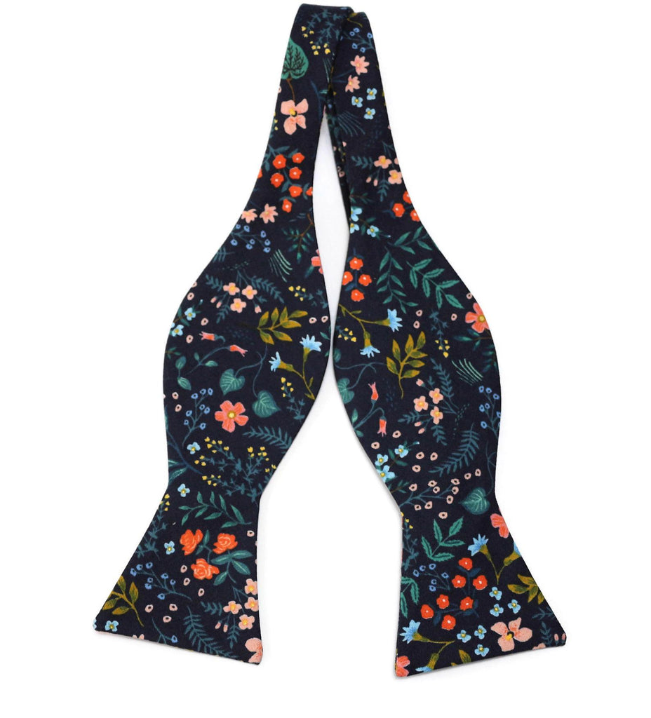 Navy Metallic Wildwood Floral Bow Tie featuring vibrant floral patterns, perfect for weddings and formal occasions.