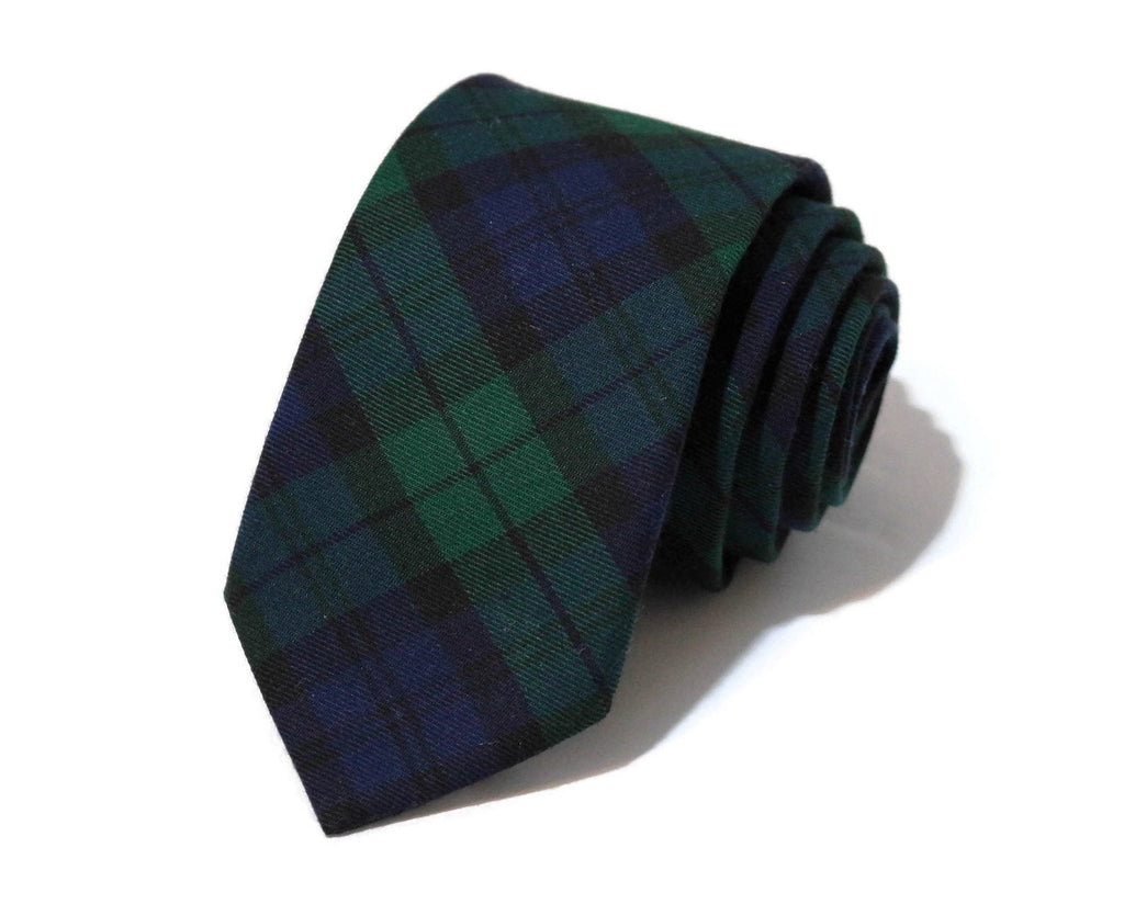Black Watch Tartan Plaid Necktie rolled on surface showcasing traditional plaid pattern for men's formal wear accessories.