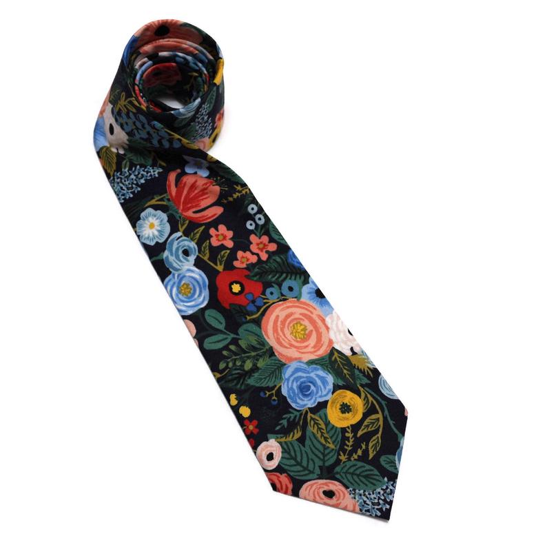 Navy Garden Party Floral Necktie, a handcrafted necktie featuring vibrant florals on a dark background, perfect for weddings and formal wear.