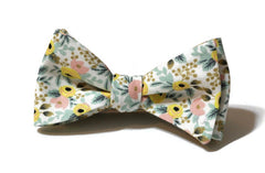 Cream Rosa Floral Bow Tie featuring a vibrant floral pattern, perfect for weddings or special occasions. Handmade bow ties for men.
