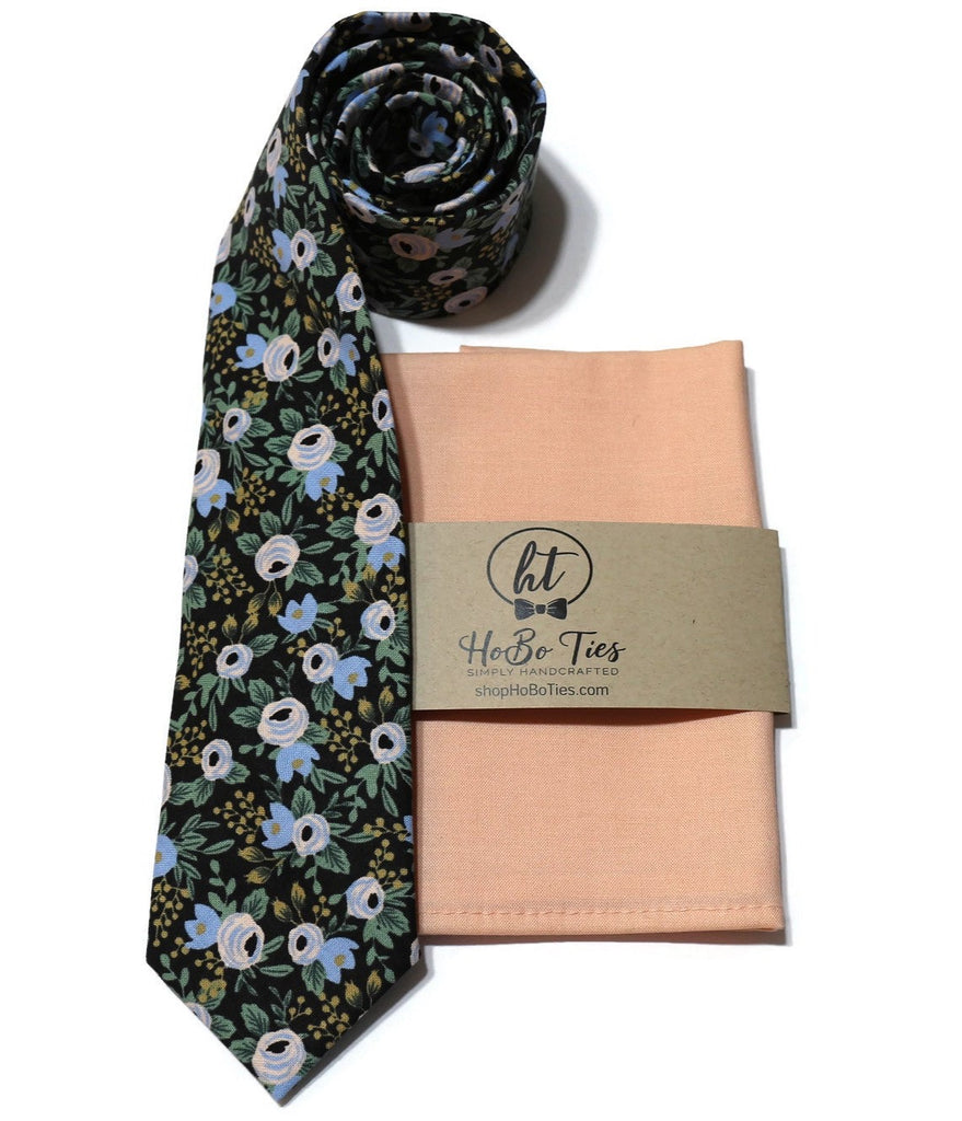 Black Rosa Floral Necktie paired with a peach pocket square, handcrafted neckties from Hobo Ties.