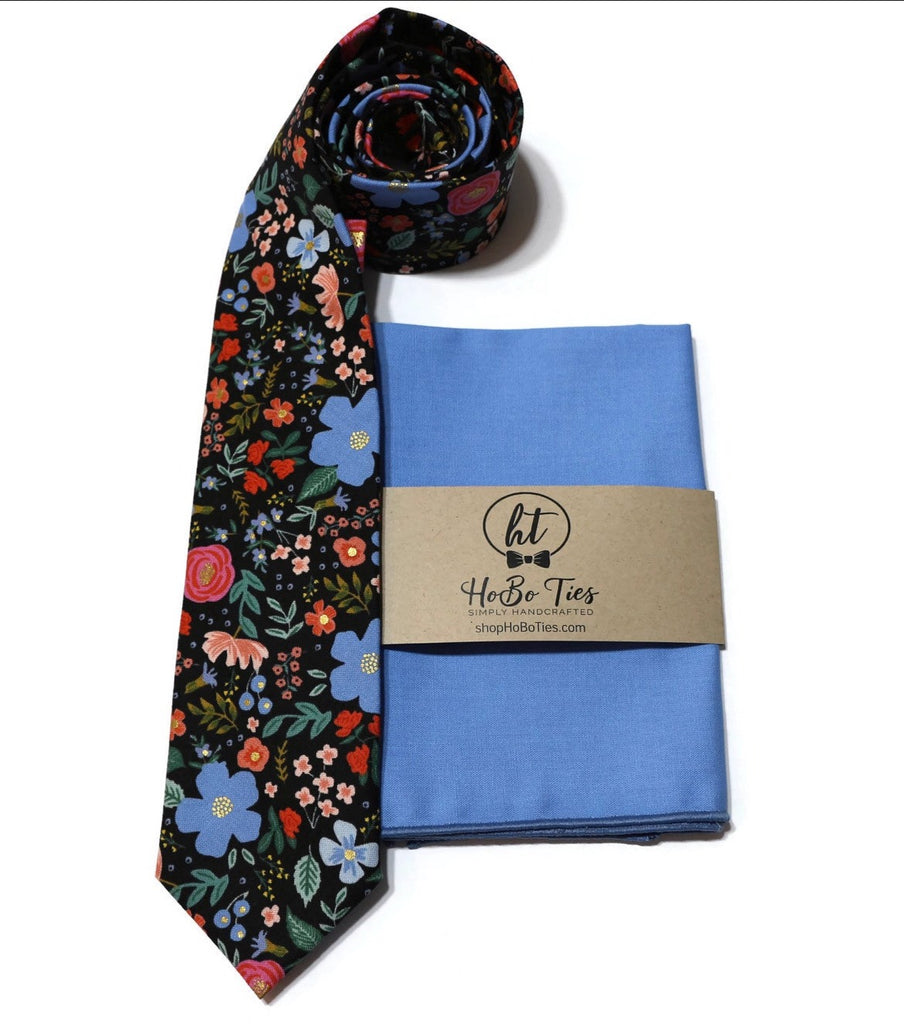 Black Wild Rose Floral Necktie paired with a blue pocket square, perfect for men’s wedding accessories and formal wear.