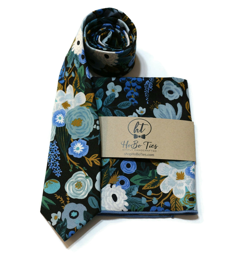 Blue Garden Party Floral Necktie paired with matching pocket square for men, showcasing vibrant floral patterns and handcrafted design.