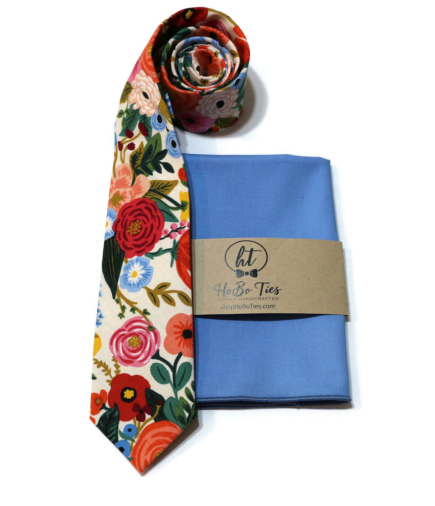 Cream Garden Party Floral Necktie alongside a blue pocket square, perfect for weddings and special occasions.