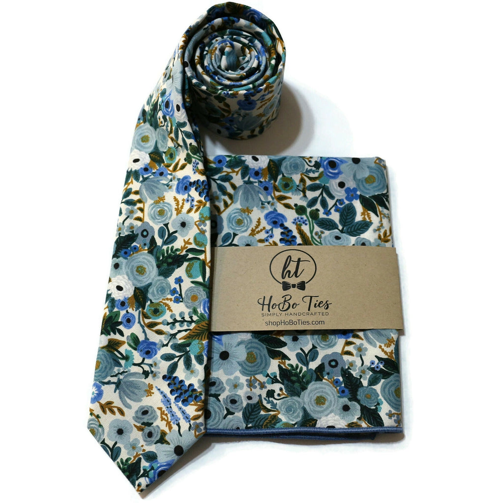 Blue Garden Party Petite Floral Necktie with matching floral pocket square and rolled tie, handcrafted neckties for men.