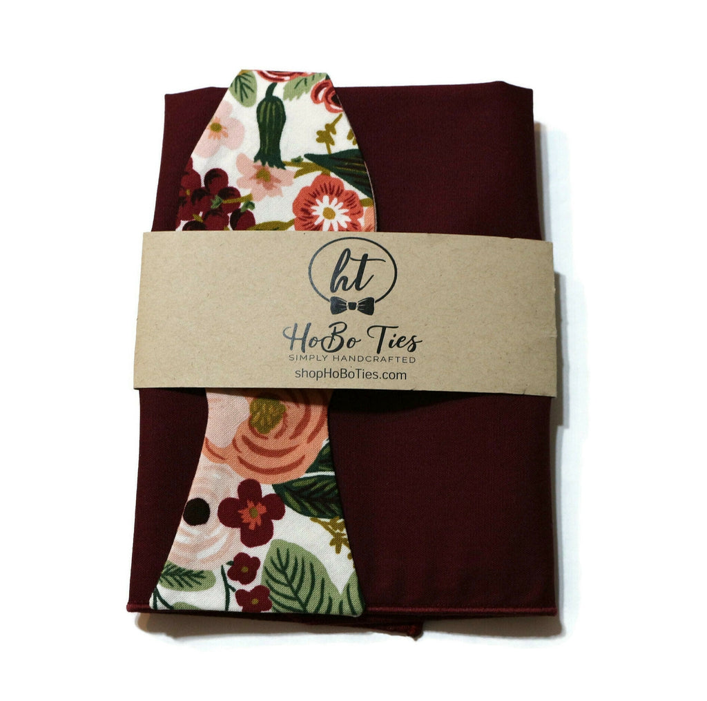 Rose Garden Party Floral Bow Tie beautifully presented with a handcrafted label, showcasing unique floral patterns.