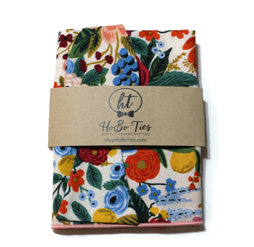 Cream Garden Party Floral Bow Tie featuring vibrant floral patterns; handcrafted neckties for men and boys.