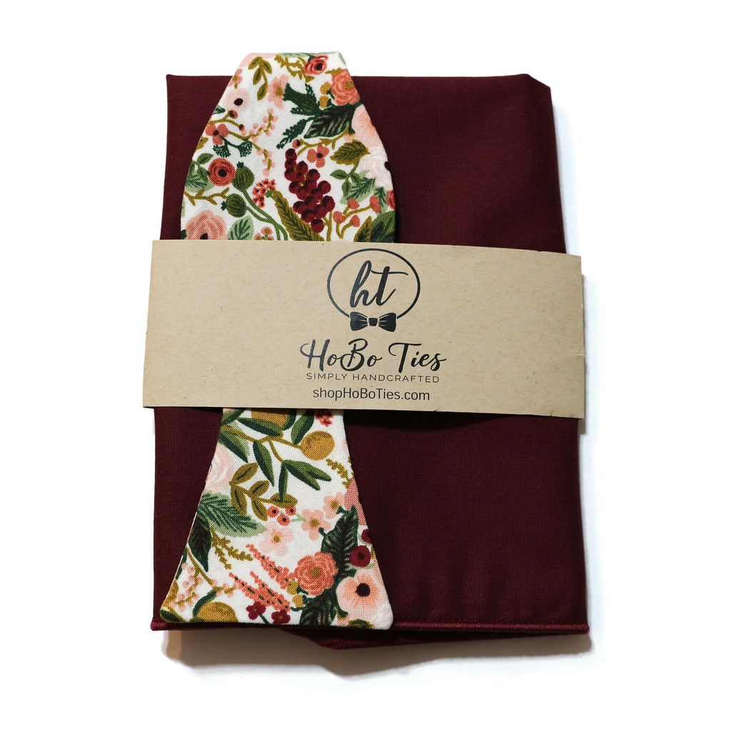 Rose Garden Party Petite Floral Bow Tie on a maroon background, handcrafted neckties for men and boys.
