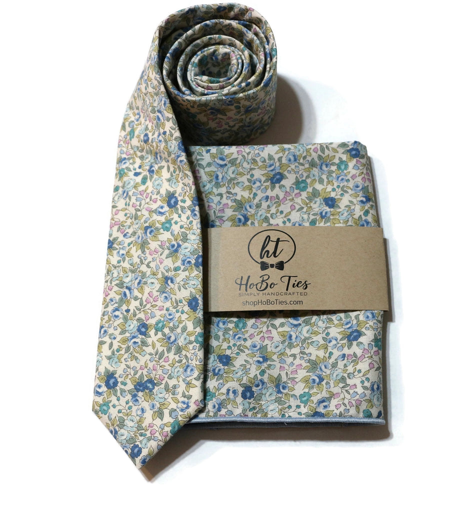Blue & Sage Floral Necktie surrounded by floral pocket square, handcrafted neckties for men and boys.