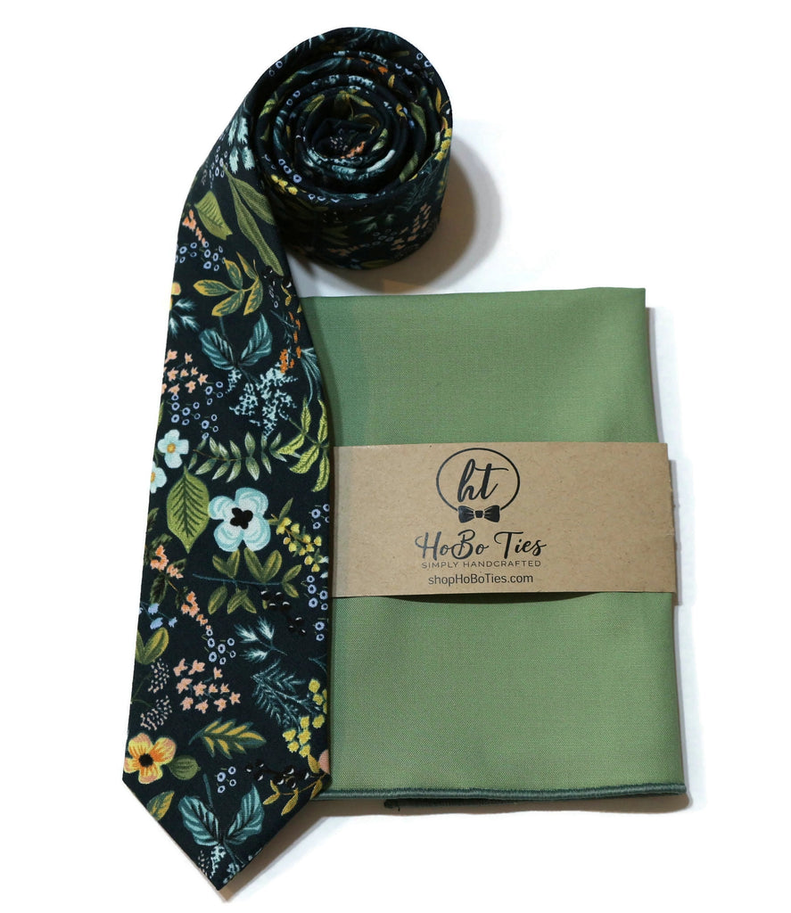 Navy Amalfi Floral Necktie paired with a green pocket square, handcrafted neckties for men’s formal wear.