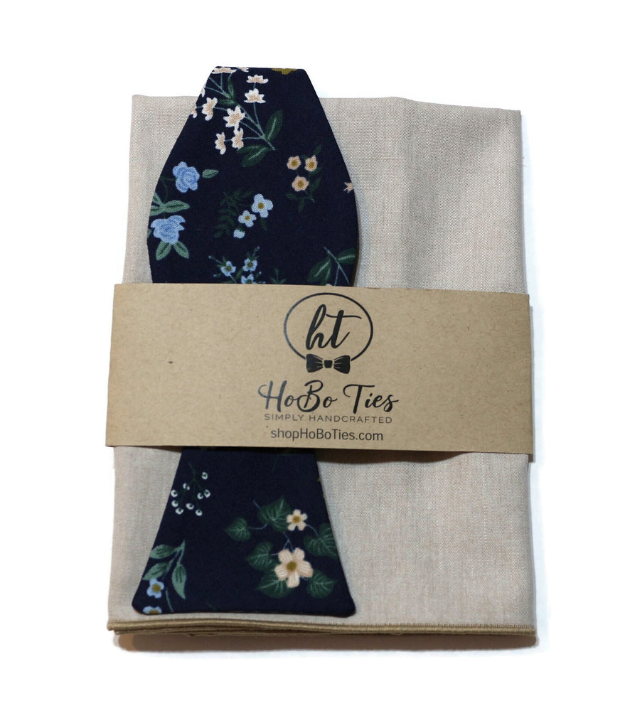 Navy Hawthorne Floral Bow Tie with matching pocket square on linen background, handcrafted neckties for men.