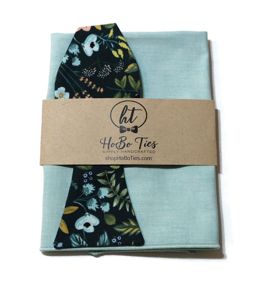 Navy Amalfi Floral Bow Tie with coordinating light blue pocket square and branding label, handcrafted neckties for men.
