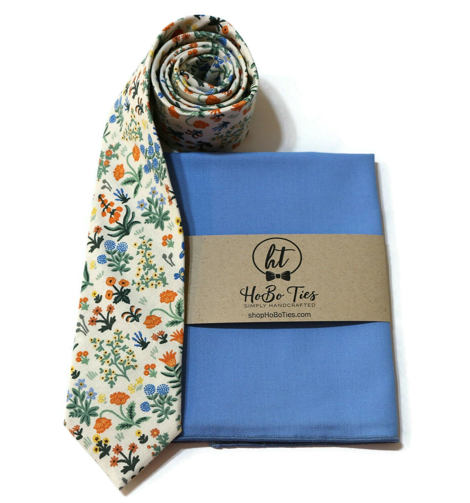 Cream Menagerie Garden Floral Necktie with blue pocket square and floral design, perfect for men’s and boys’ wedding accessories.