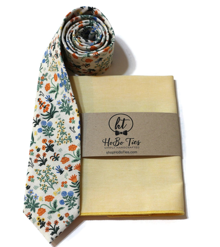 Cream Menagerie Garden Floral Necktie with accompanying pocket square, handcrafted neckties and unique floral patterns.