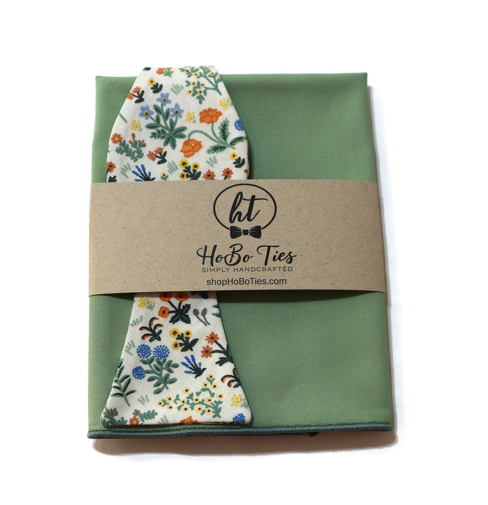 Cream Menagerie Garden Floral Bow Tie with a green pocket square, perfect for handmade bow tie enthusiasts.