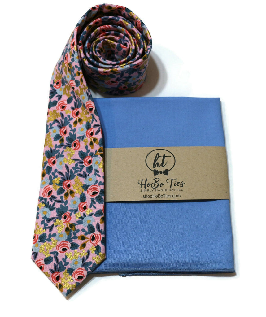 Violet Metallic Rosa Floral Necktie paired with a blue pocket square, handcrafted neckties, wedding accessories for men.