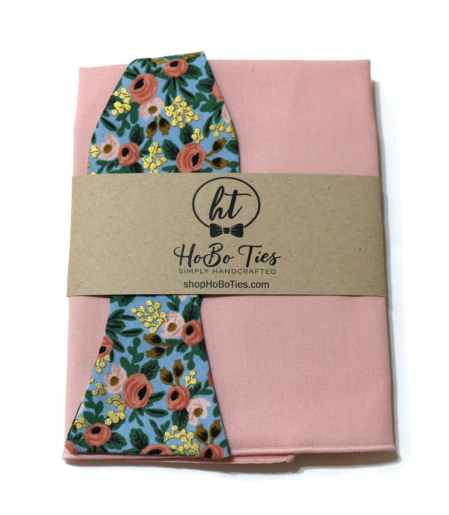 Chambray Metallic Rosa Floral Bow Tie wrapped in pink fabric by HoBo Ties, showcasing floral design and handmade quality.