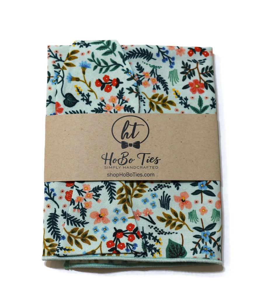 Mint Metallic Wildwood Floral Bow Tie with floral fabric design, handcrafted neckties for men's formal wear.