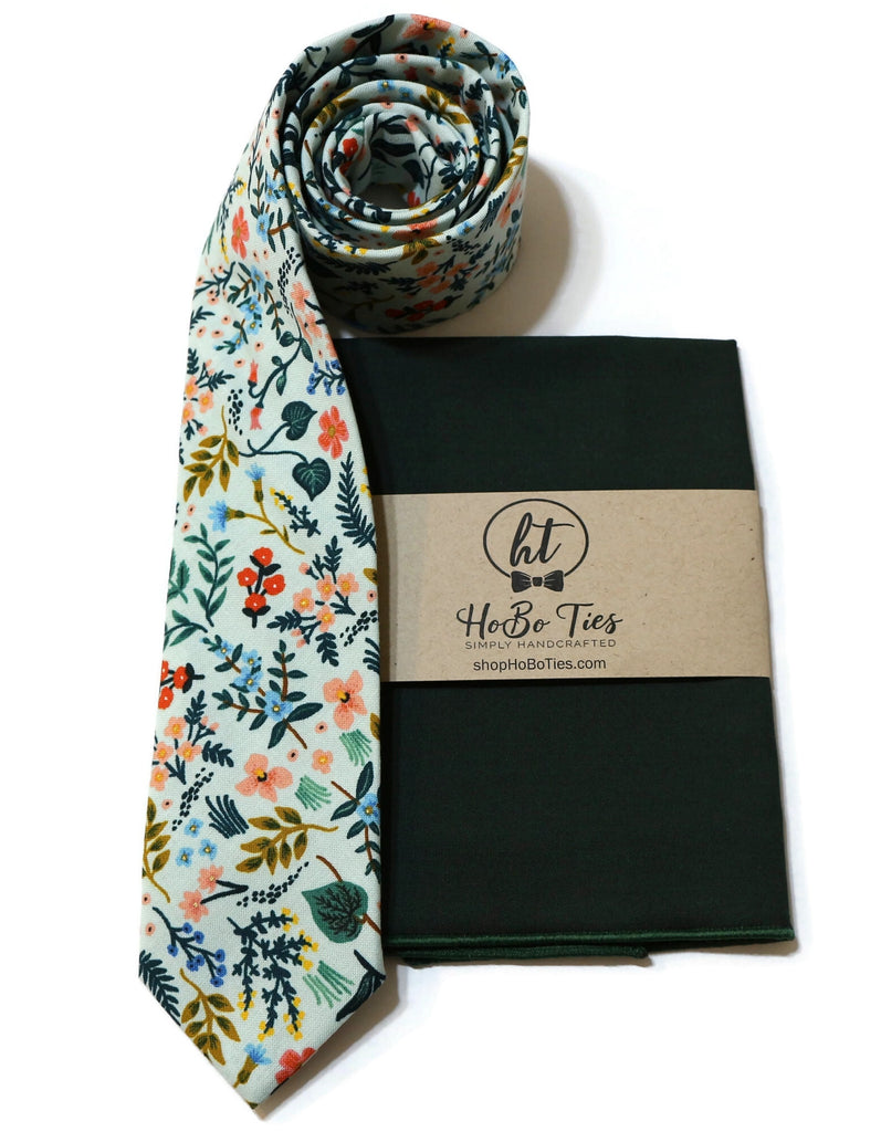 Mint Metallic Wildwood Floral Necktie displayed with coordinating pocket square, a perfect handmade accessory for men.