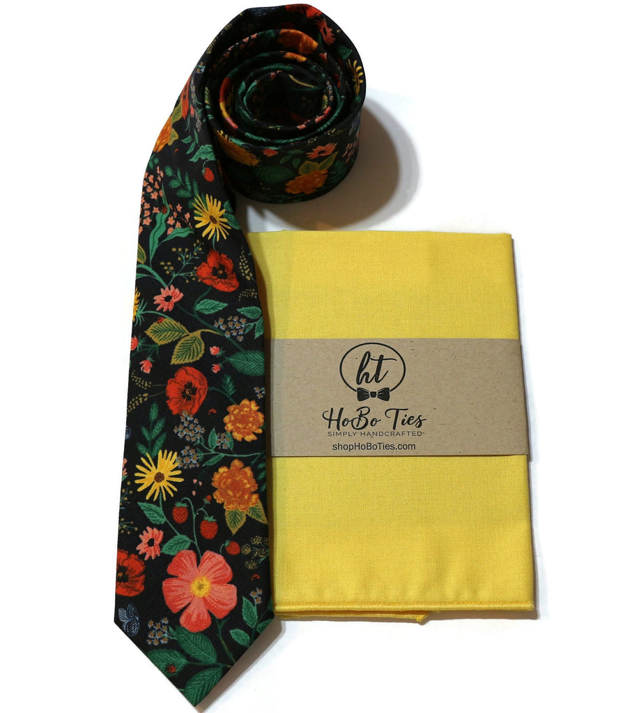Black Poppy Fields Floral Necktie paired with a yellow pocket square, perfect for men’s formal wear accessories.