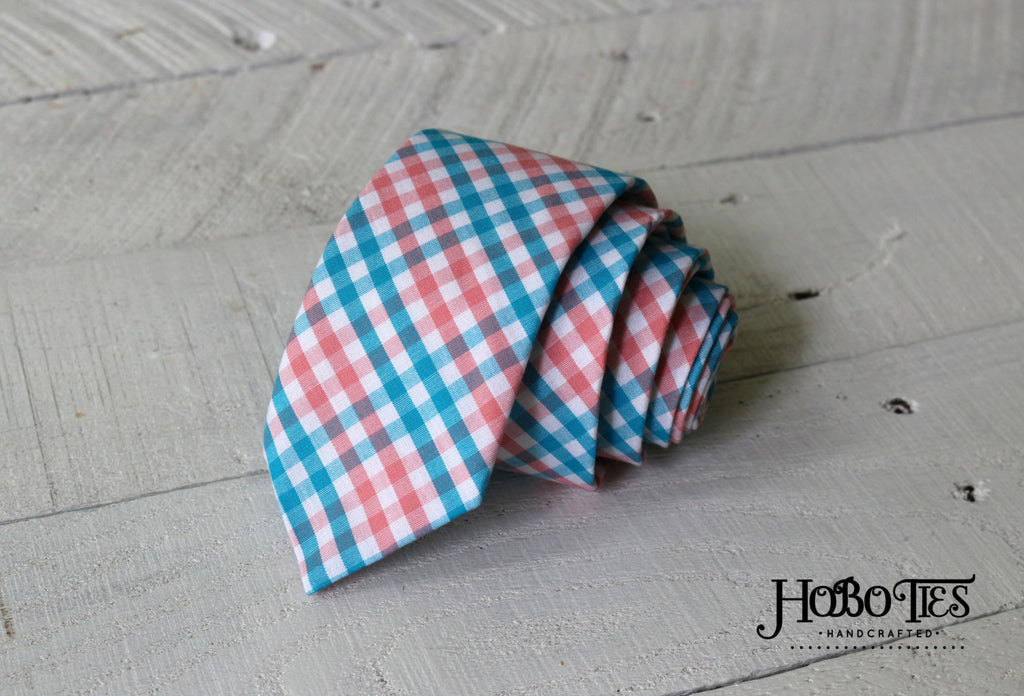 Turquoise & Coral Tattersall Necktie, a handcrafted necktie featuring a vibrant plaid pattern.